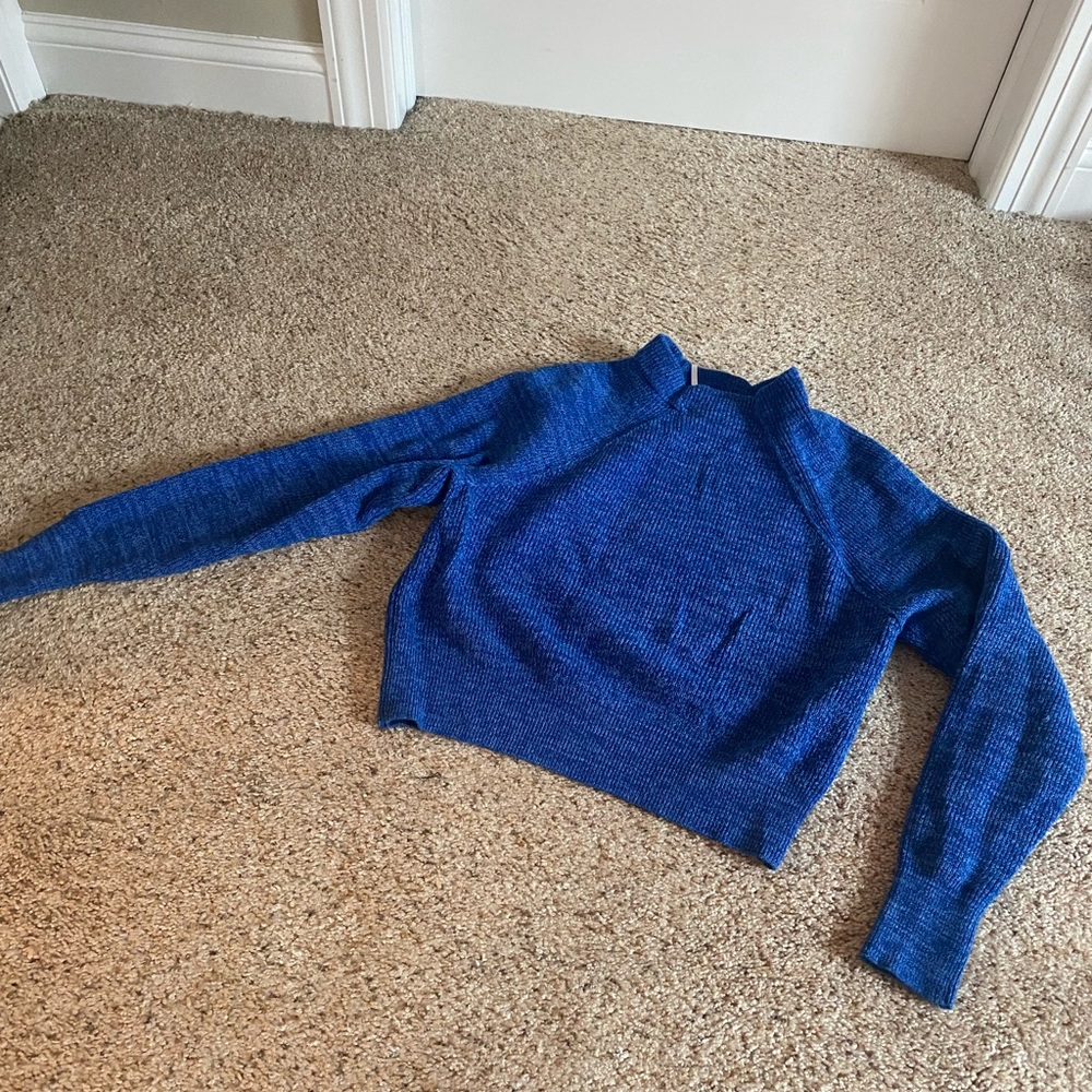 Super cute Free People sweater.  Short torso length and long arm length.